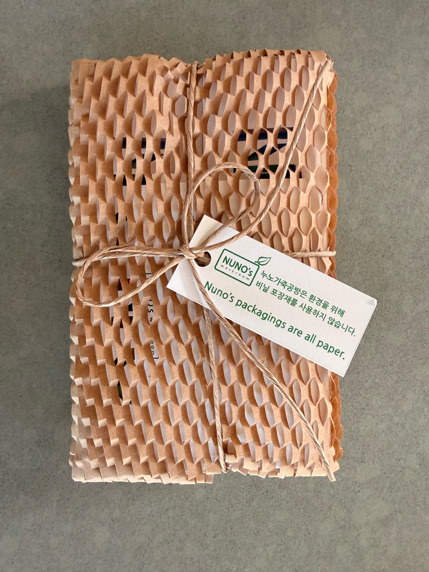 NUNOworkroom unboxing - honeycomb paper packaging with twine bow