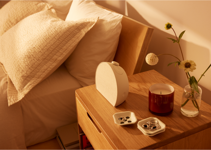 Hatch Restore 3 lifestyle - the device in context on a bedside table