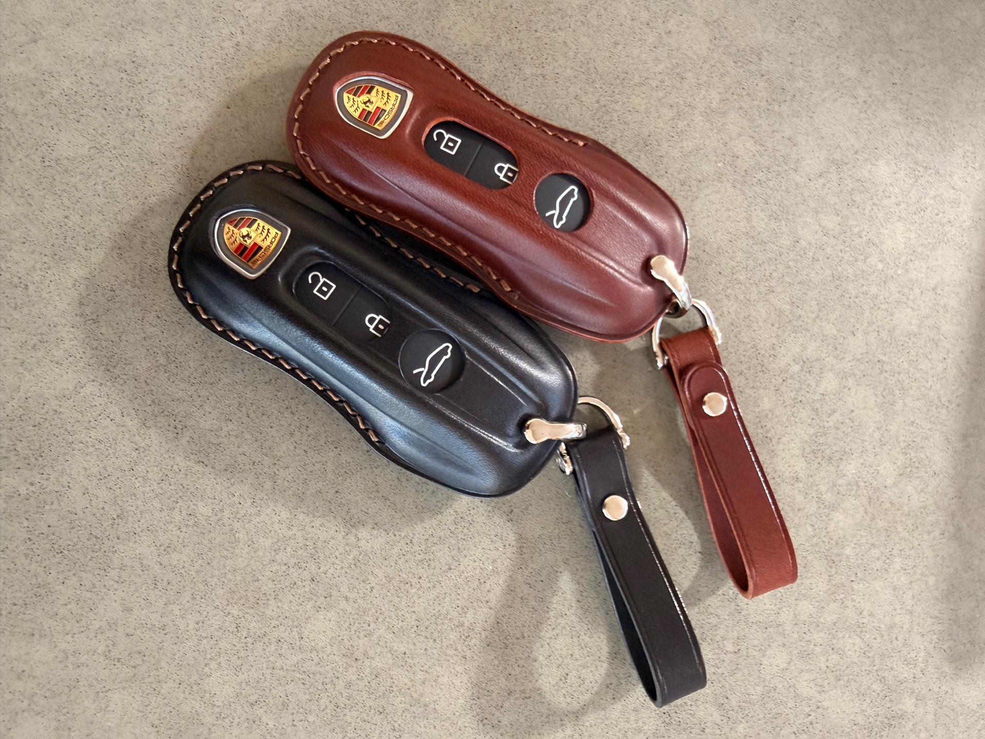 NUNOworkroom Porsche key fob covers with keys inserted - dark brown and black